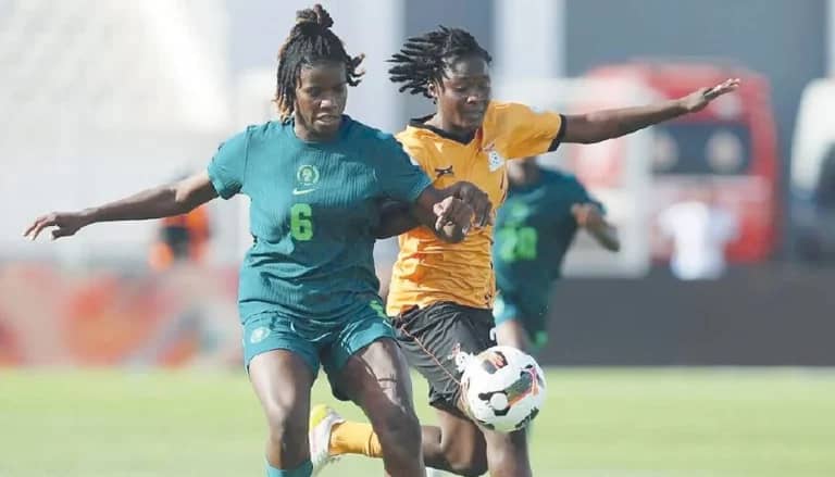 Super Falcons team member in action against Copper Queens of Zambia player in previous matchup